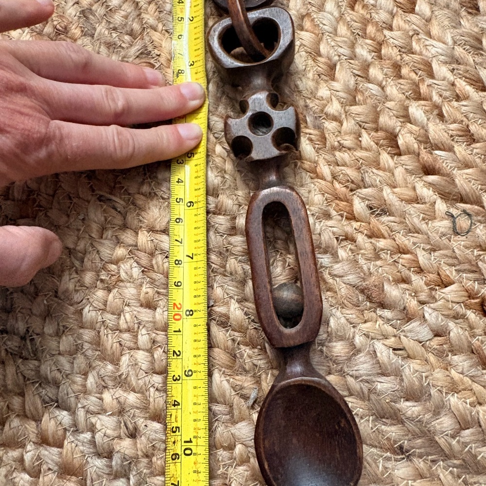 Hand-Carved Wooden Spoon with Decorative Linkage